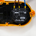 Close-up of a Shelly 2PM Gen3 x2 device installed in a yellow wall-mounted enclosure, showing wiring connections and a front panel diagram.