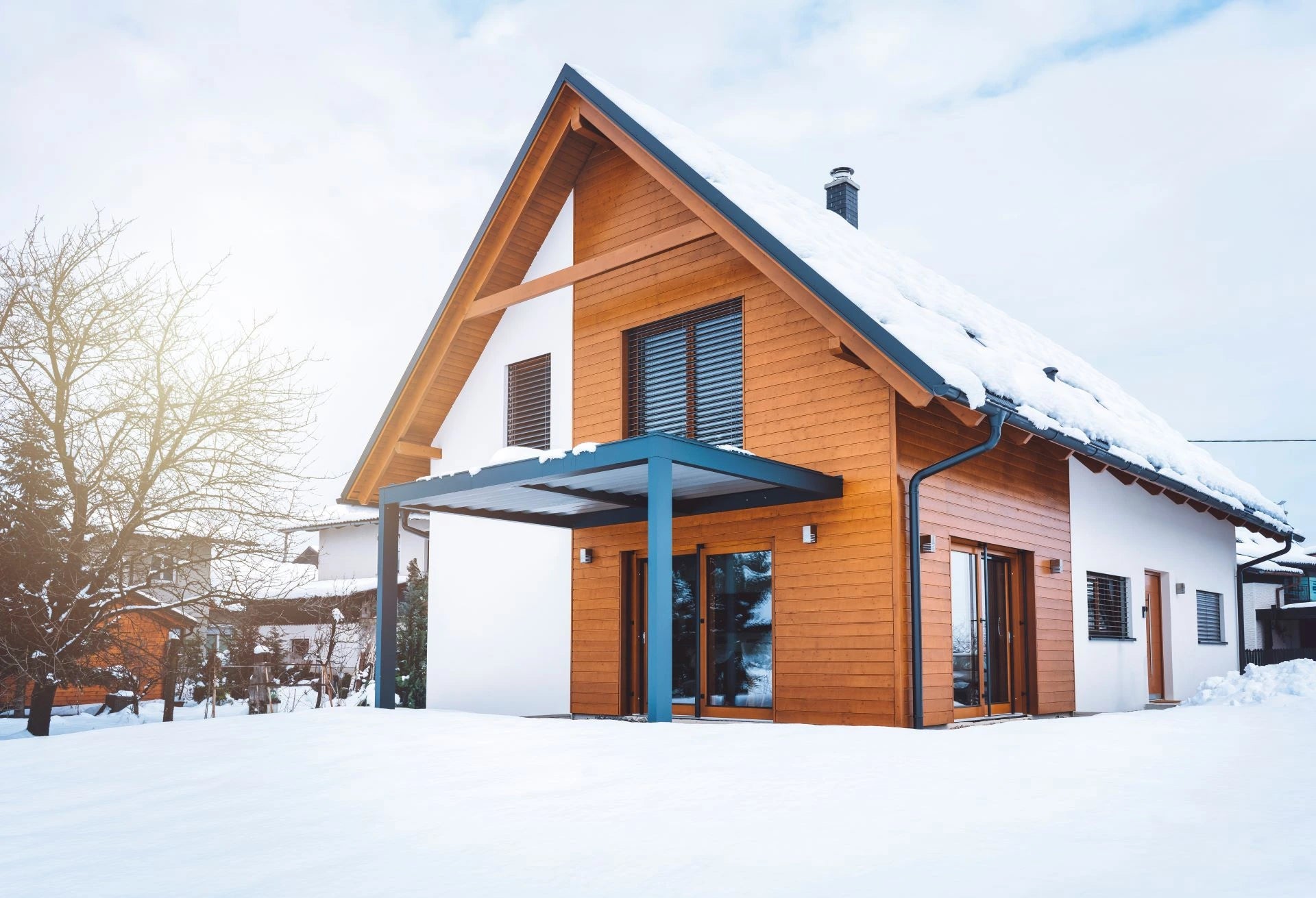 snow-covered holiday home; smart frost protection monitors temperature and prevents freezing while you are away