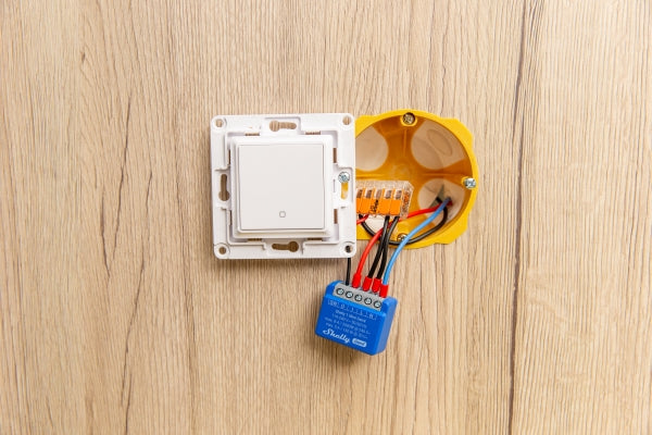 Installation of Shelly 1 Mini Gen4 smart switch behind a wall light switch for smart home lighting control