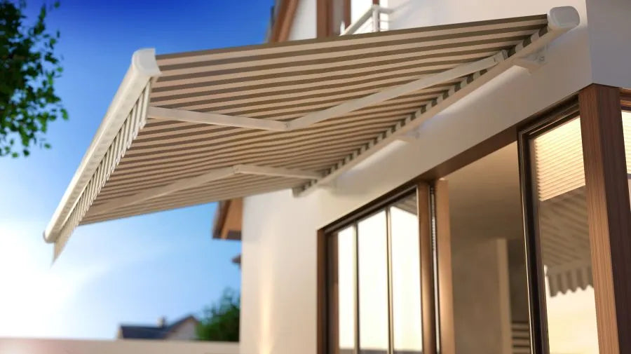 motorised awning on a house wall; smart-home awning control can be retrofitted with a Shelly relay