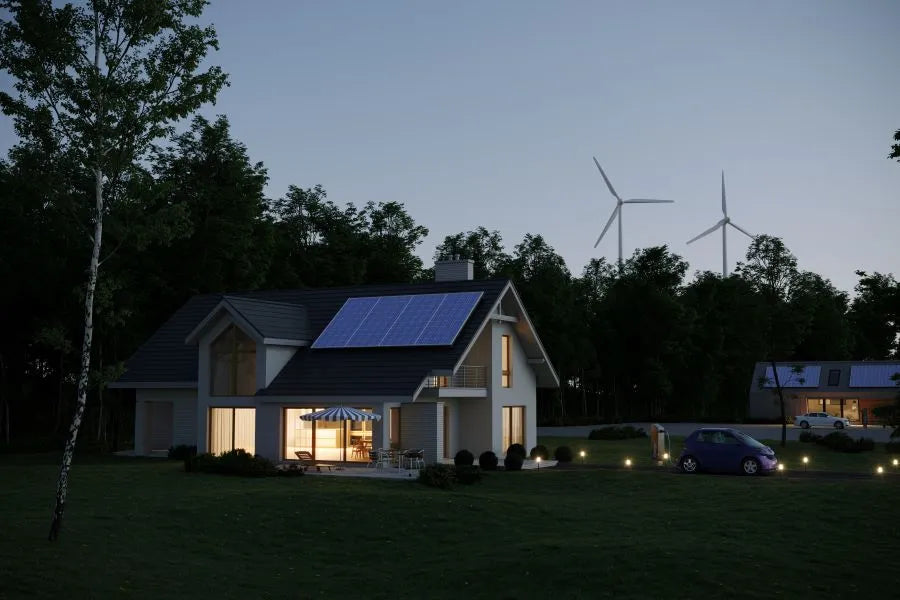 illuminated house at dusk; presence simulation protects against burglary when you are away.